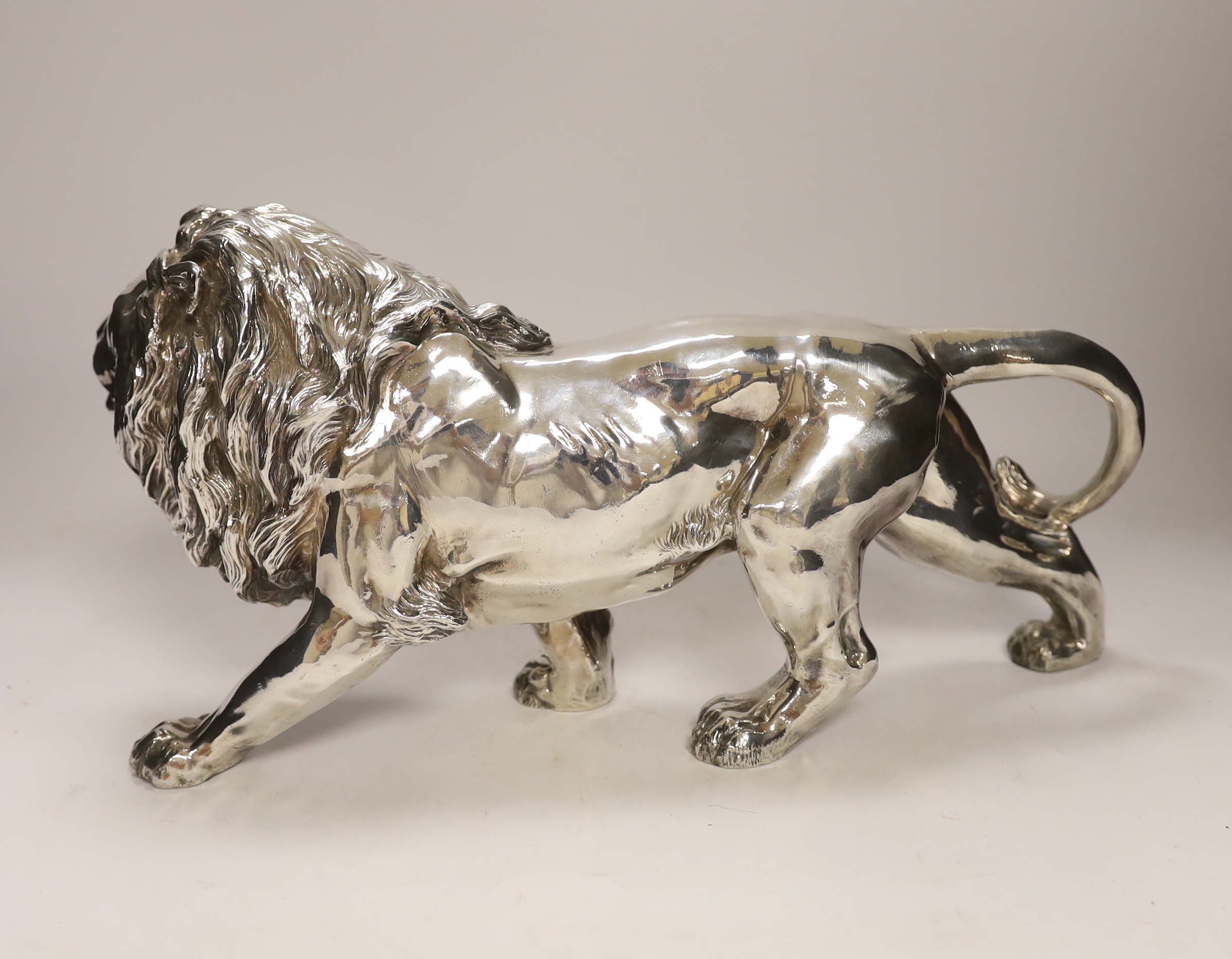 A large modern silver (filled) model of a lion, Camelot Silverware Ltd, London, 2008, 40cm long